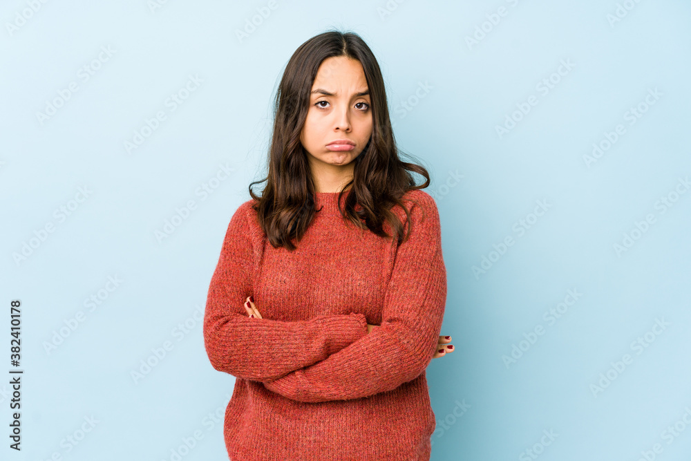 Fototapeta premium Young mixed race hispanic woman isolated unhappy looking in camera with sarcastic expression.