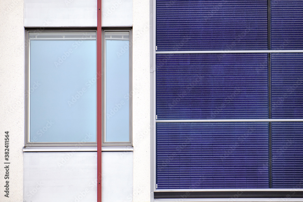 Solar panels on the facade of a residential building in Finland.