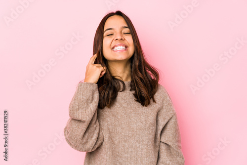 Young mixed race hispanic woman isolated celebrating a victory, passion and enthusiasm, happy expression. © Asier