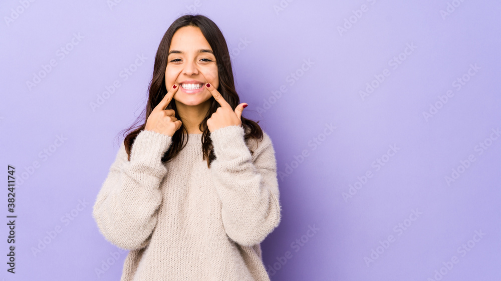 Young mixed race hispanic woman isolated doubting between two options. Young mixed race hispanic woman isolated doubting between two options.