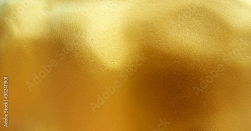Gold wall paint abstract background with texture. 
