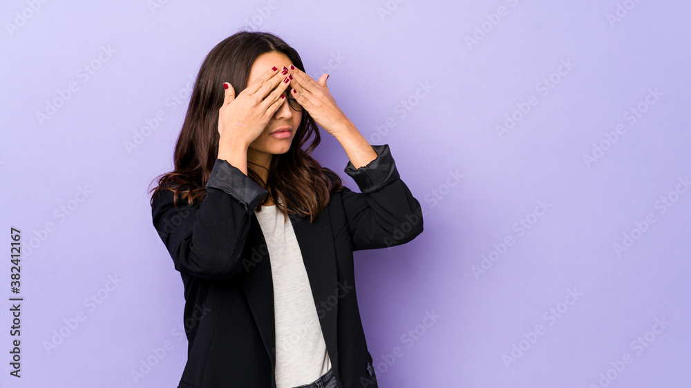 Young mixed race hispanic woman isolated afraid covering eyes with hands. Young mixed race hispanic woman isolated afraid covering eyes with hands.