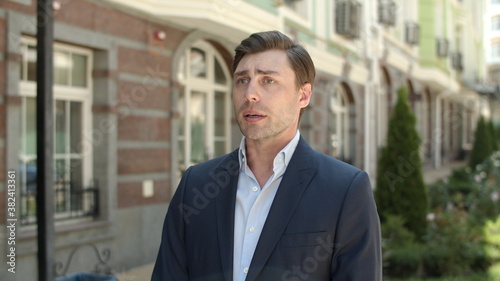 Wallpaper Mural Closeup businessman checking time. Businessman waiting for appointment at street Torontodigital.ca