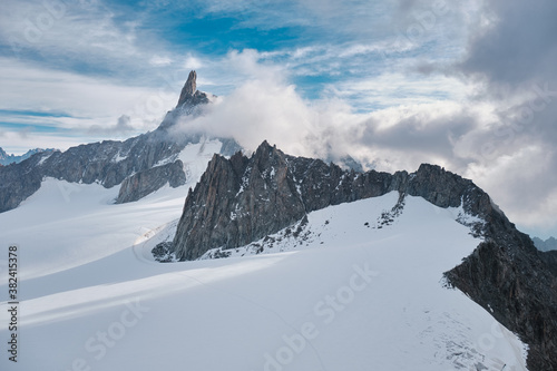 Gigant Tooth peak surrounded by clouds