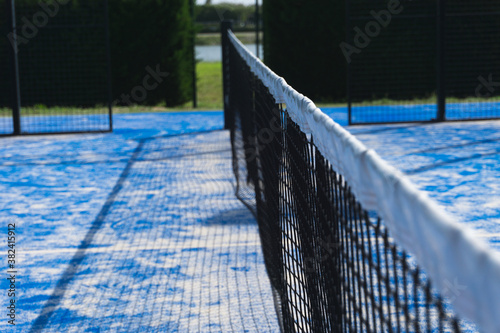 Paddle tennis outdoor court and net. Selective focus.