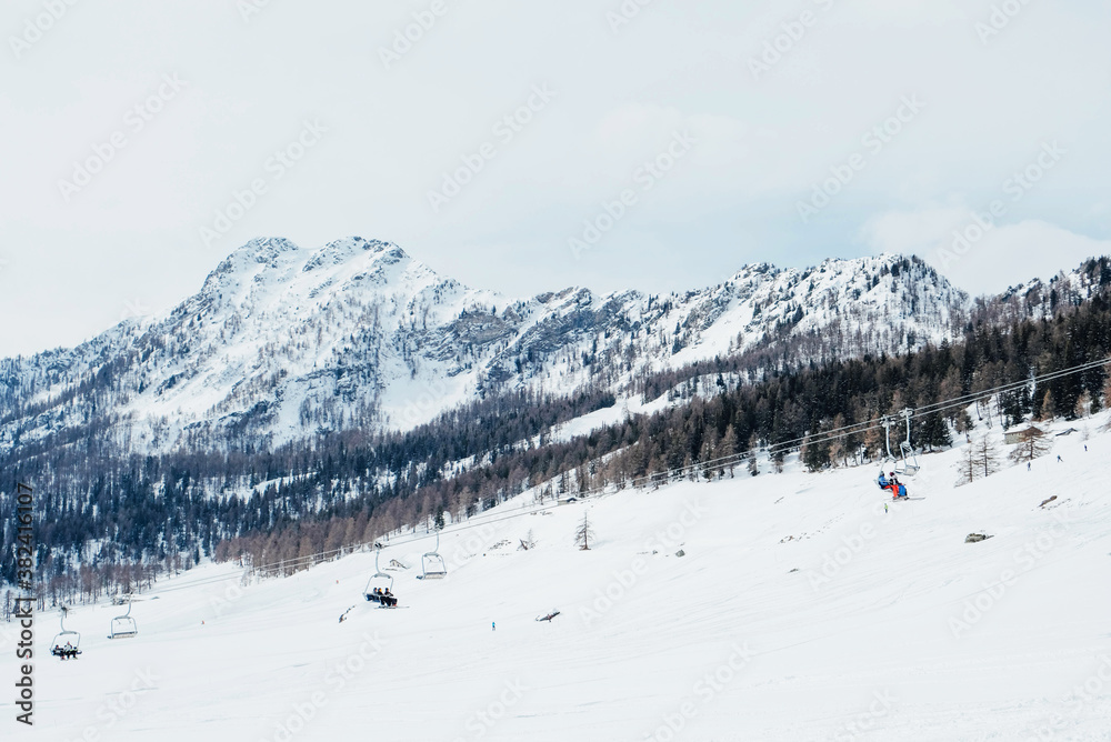 Obraz premium Winter landscape with mountain slopes covered with snow.