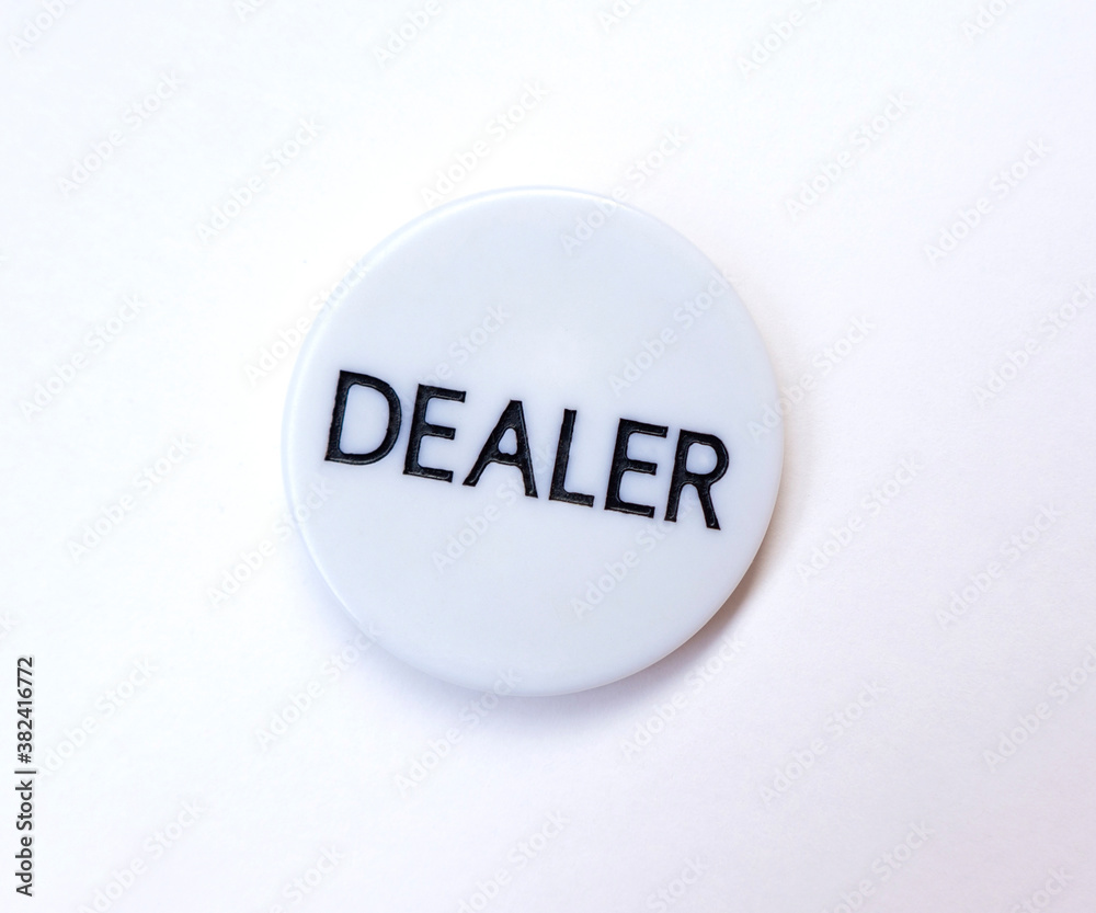 Poker dealer`s button on white background Poker dealer`s button on white background
