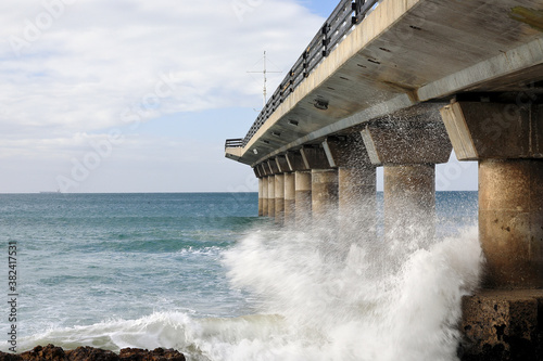 Water spalshing against the Humewood pier