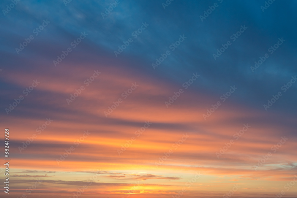 Orange and blue clouds at sunrise