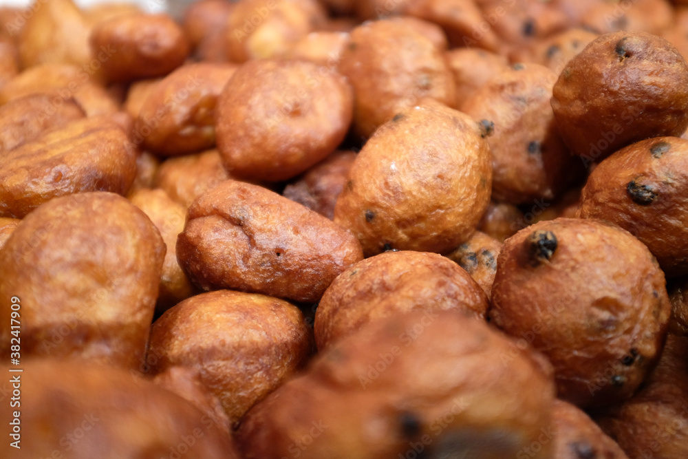 close up of a pile of Dutch oliebollen close up of a pile of Dutch oliebollen