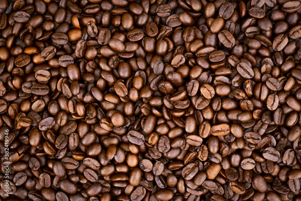 Top view of brown roasted coffee beans, can be use as background, copy space for text. Top view of brown roasted coffee beans, can be use as background, copy space for text.