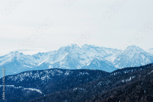 Winter landscape with mountain slopes covered with snow. © Iryna
