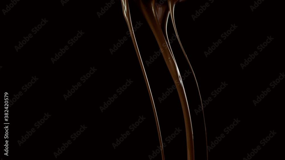 Super slow motion of pouring hot chocolate on black background. Filmed with high speed cinema camera, 1000fps. Super slow motion of pouring hot chocolate on black background. Filmed with high speed cinema camera, 1000fps.