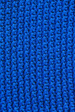 Blue knitted fabric texture background. Top view. Copy, empty space for text