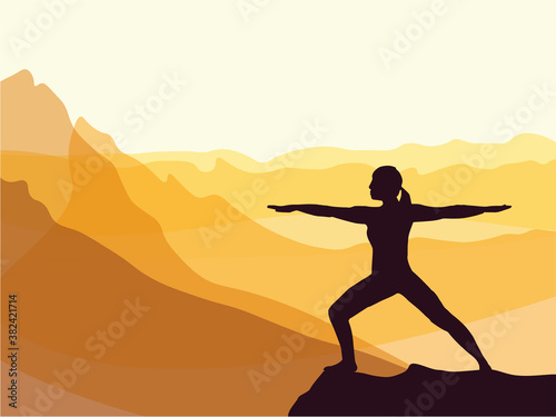 Silhouette of girl practicing yoga. Mountains in the background. Sunrise, yoga sun salutation. Healthy lifestyle.