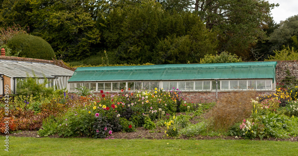 Classic brick built greenhouse in a garden.