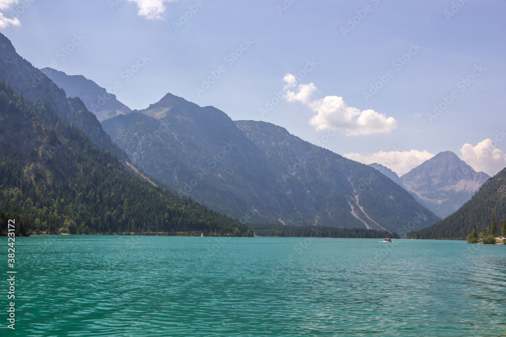 
sunny day on the turquoise Lake Plansee in the Austrian Alps
