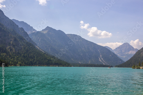  sunny day on the turquoise Lake Plansee in the Austrian Alps