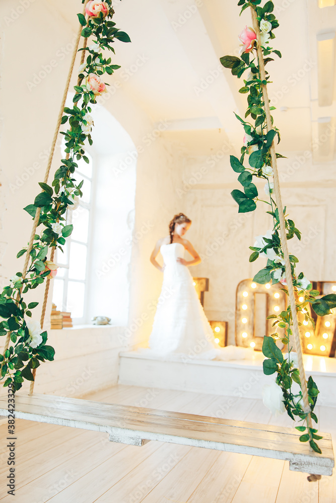 Fototapeta premium Wedding day and beautiful bride in studio. Beautiful young bride with wedding makeup and hairstyle. Portrait of young gorgeous bride. Wedding.