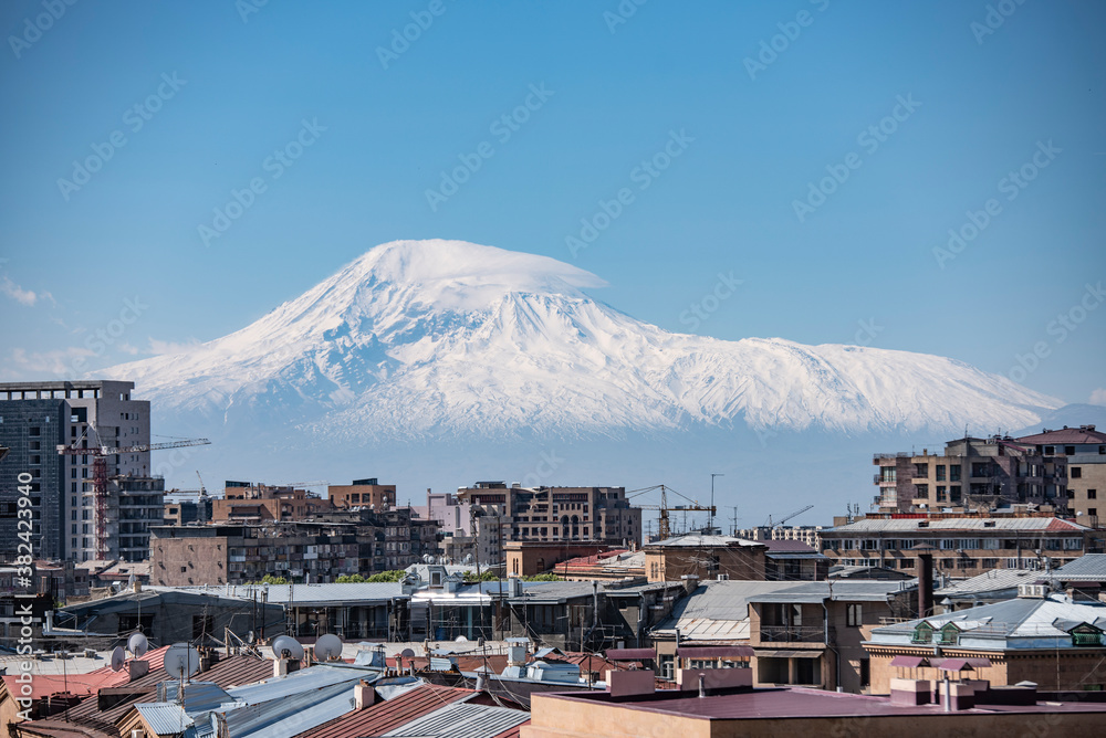 Aerial view of Yerevan, capital of Armenia. City on snowy Ararat mount background.