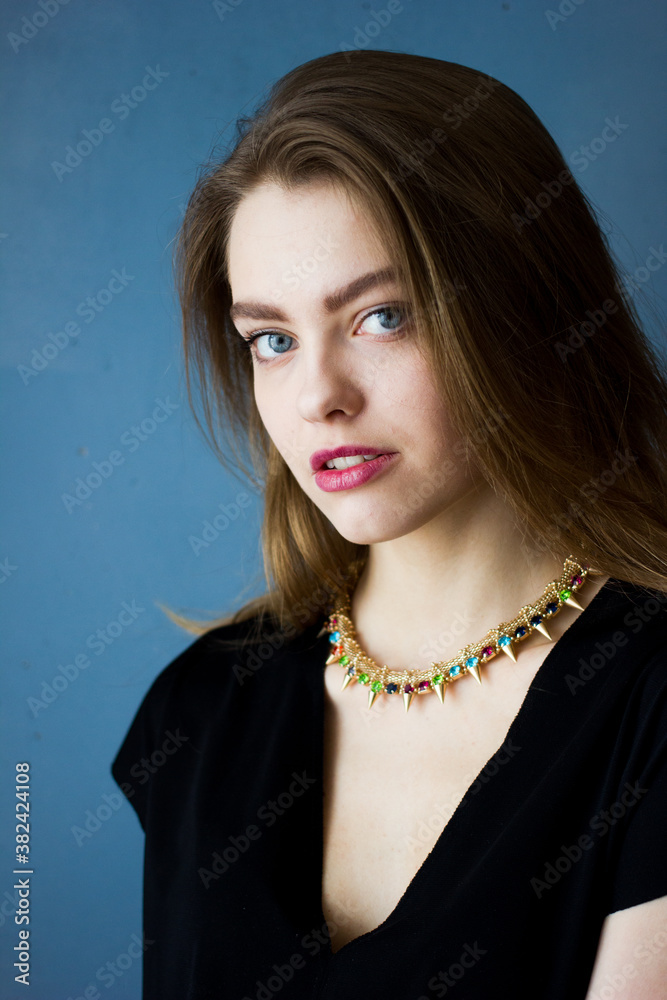 Beautiful blonde hair lady with blue eyes in black t-shirt, portrait