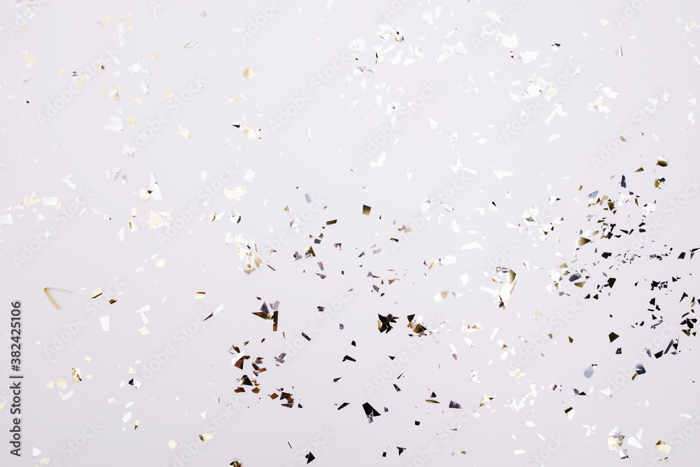 Gold and silver sparkles and glitter on off white trendy background. Festive backdrop for your projects. Gold and silver sparkles and glitter on off white trendy background. Festive backdrop for your projects.