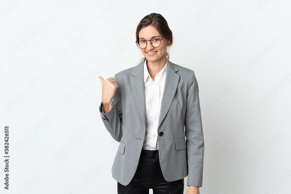 Business Ireland woman isolated on white background pointing to the side to present a product Business Ireland woman isolated on white background pointing to the side to present a product