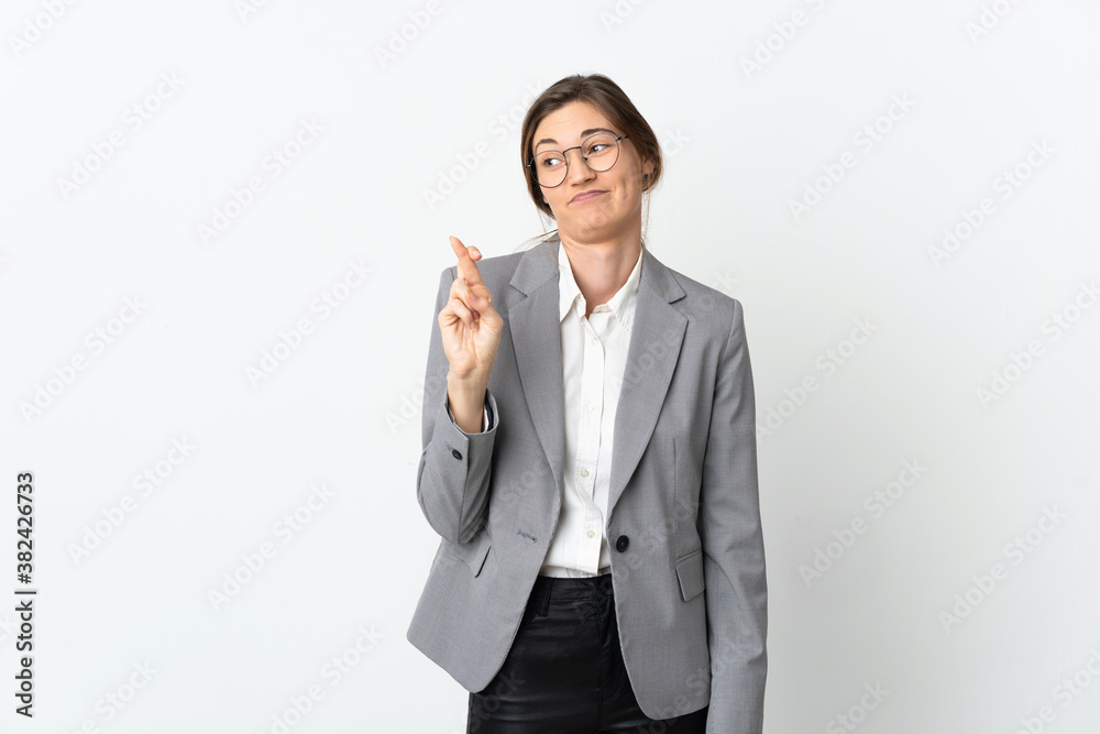 Business Ireland woman isolated on white background with fingers crossing and wishing the best Business Ireland woman isolated on white background with fingers crossing and wishing the best