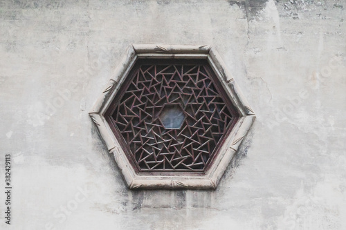 Background of traditional Chinese hexagon window on white wall