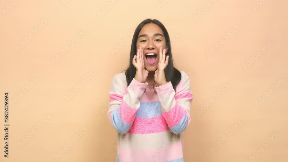 Young mixed race indian woman shouting excited to front Young mixed race indian woman shouting excited to front