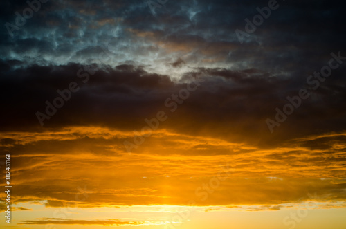Fototapeta Naklejka Na Ścianę i Meble -   sunset over field with orange sky