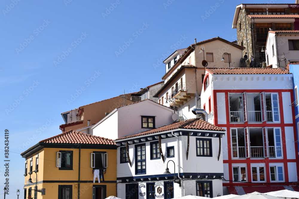Obraz premium Little sailor town in Asturias, Spain with colorful houses near the port and the sea