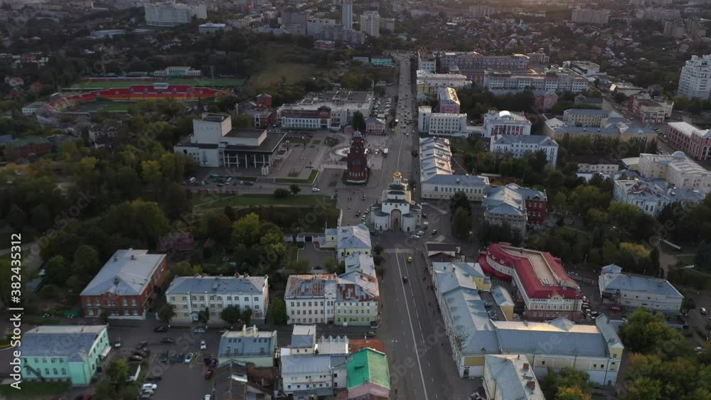 a panoramic view of the city with ancient churches and buildings against the backdrop of green trees filmed from a drone a panoramic view of the city with ancient churches and buildings against the backdrop of green trees filmed from a drone