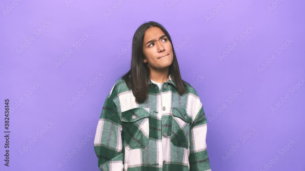 Young mixed race indian woman confused, feels doubtful and unsure Young mixed race indian woman confused, feels doubtful and unsure