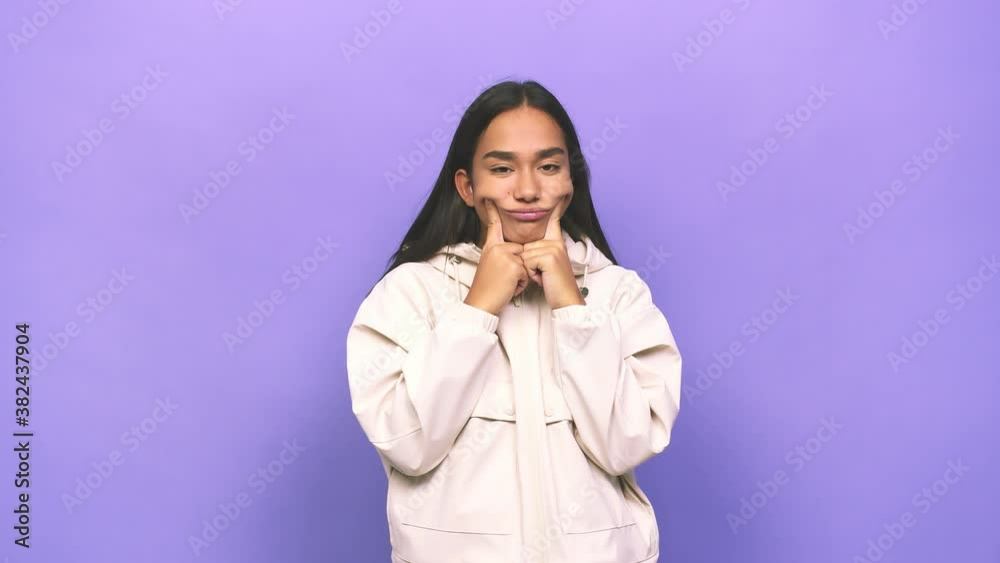 Young mixed race indian woman doubting between two options Young mixed race indian woman doubting between two options