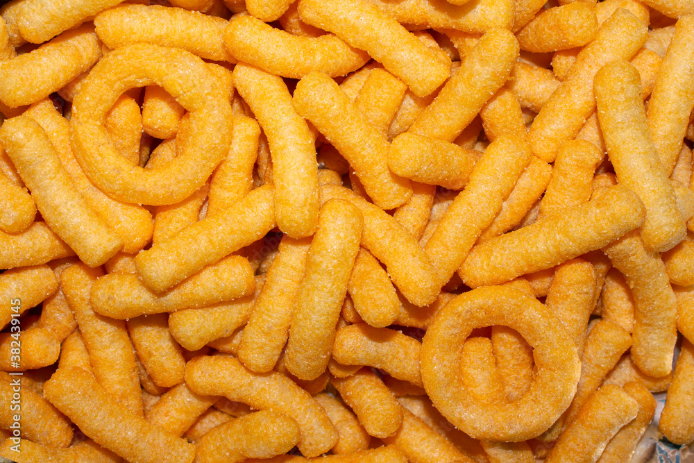 top view of cheese flavored corn snacks top view of cheese flavored corn snacks