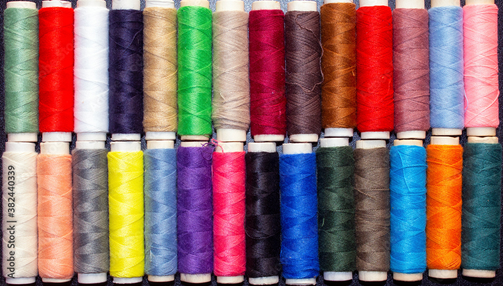 top view of spools with threads of different colors top view of spools with threads of different colors