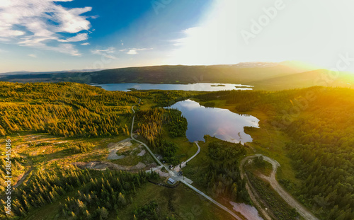 Bamselitjernet lake near Beitostolen surrounded by forests during sunset, Norway photo