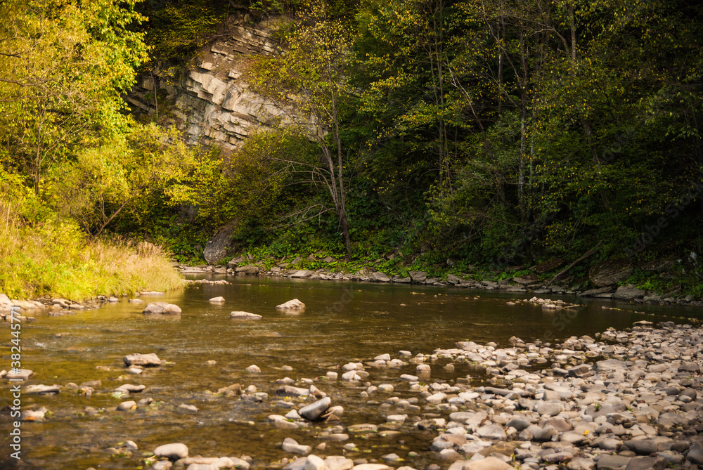 Solitude by the river. A great place for weekend excursion in the Carpathian Mountains in autumn. A perfect spot for fly fishing. Solitude by the river. A great place for weekend excursion in the Carpathian Mountains in autumn. A perfect spot for fly fishing.