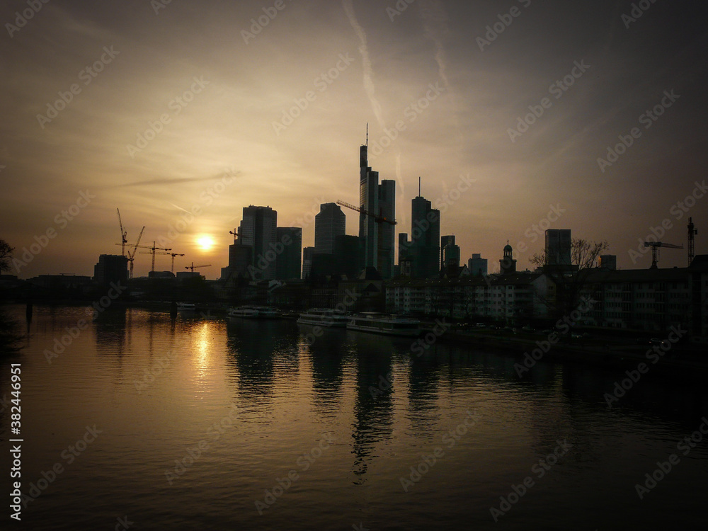 sunset over downtown Frankfurt and the river Main
