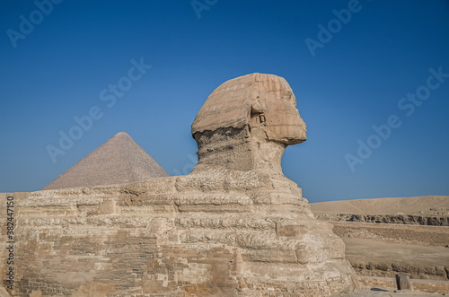 Egyptian Sphinx. Ancient Egyptian Ruins and Pyramids. The sandy desert in Cairo.