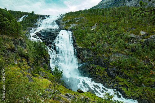 Nyastolfossen falls, second in cascade of four waterfalls in Husedalen valley, Kinsarvik, Norway