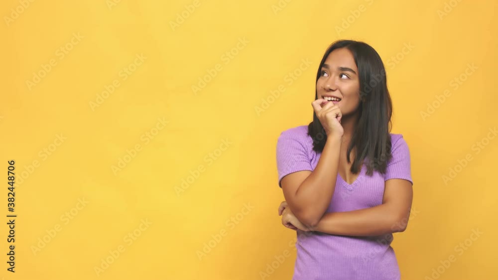 Young mixed race indian woman relaxed thinking about something looking at a copy space Young mixed race indian woman relaxed thinking about something looking at a copy space