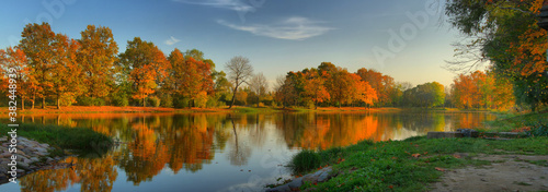 Panorama of the river Bank and trees with autumn colorful foliage