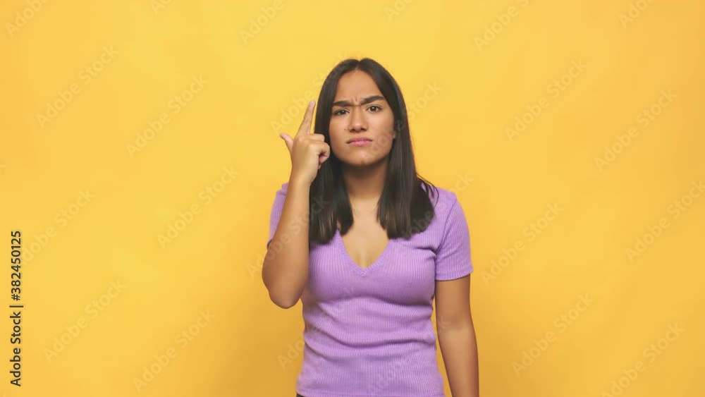 Young mixed race indian woman showing a disappointment gesture with forefinger Young mixed race indian woman showing a disappointment gesture with forefinger