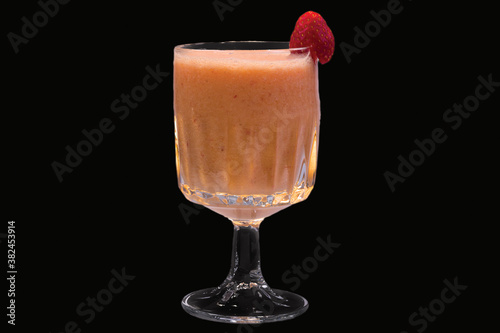 a delicious banana and strawberry smoothie in a glass,