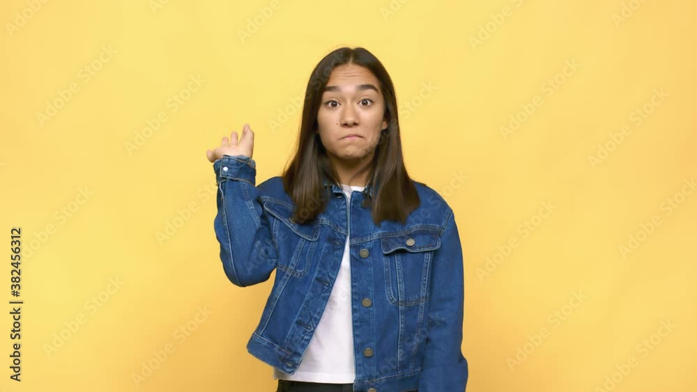 Young mixed race indian woman with fingers on lips keeping a secret Young mixed race indian woman with fingers on lips keeping a secret