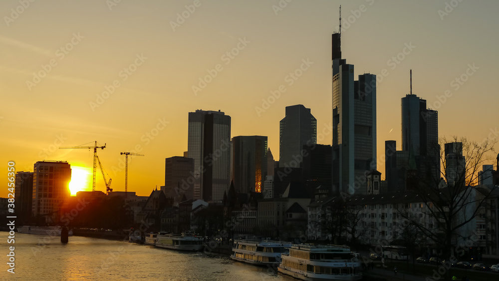 Frankfurt on Main Germany view over the Main river to the skyline of financial district in the evening Frankfurt on Main Germany view over the Main river to the skyline of financial district in the evening