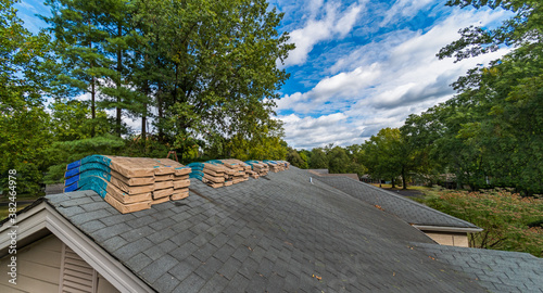 Принти на полотні Shingle Bundles Stacked on Roof to Repair Storm Weather Damage