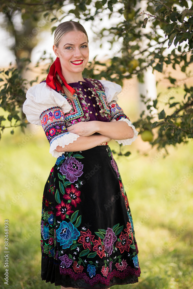 Young beautiful slovak woman in traditional costume. Slovak folklore.